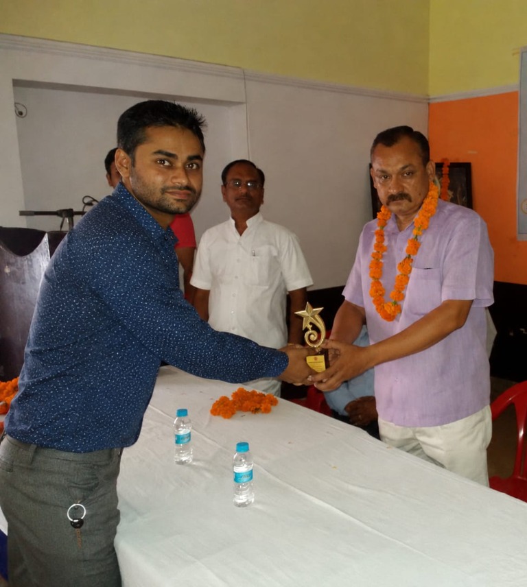 DTCI founder receiving an award at a community event